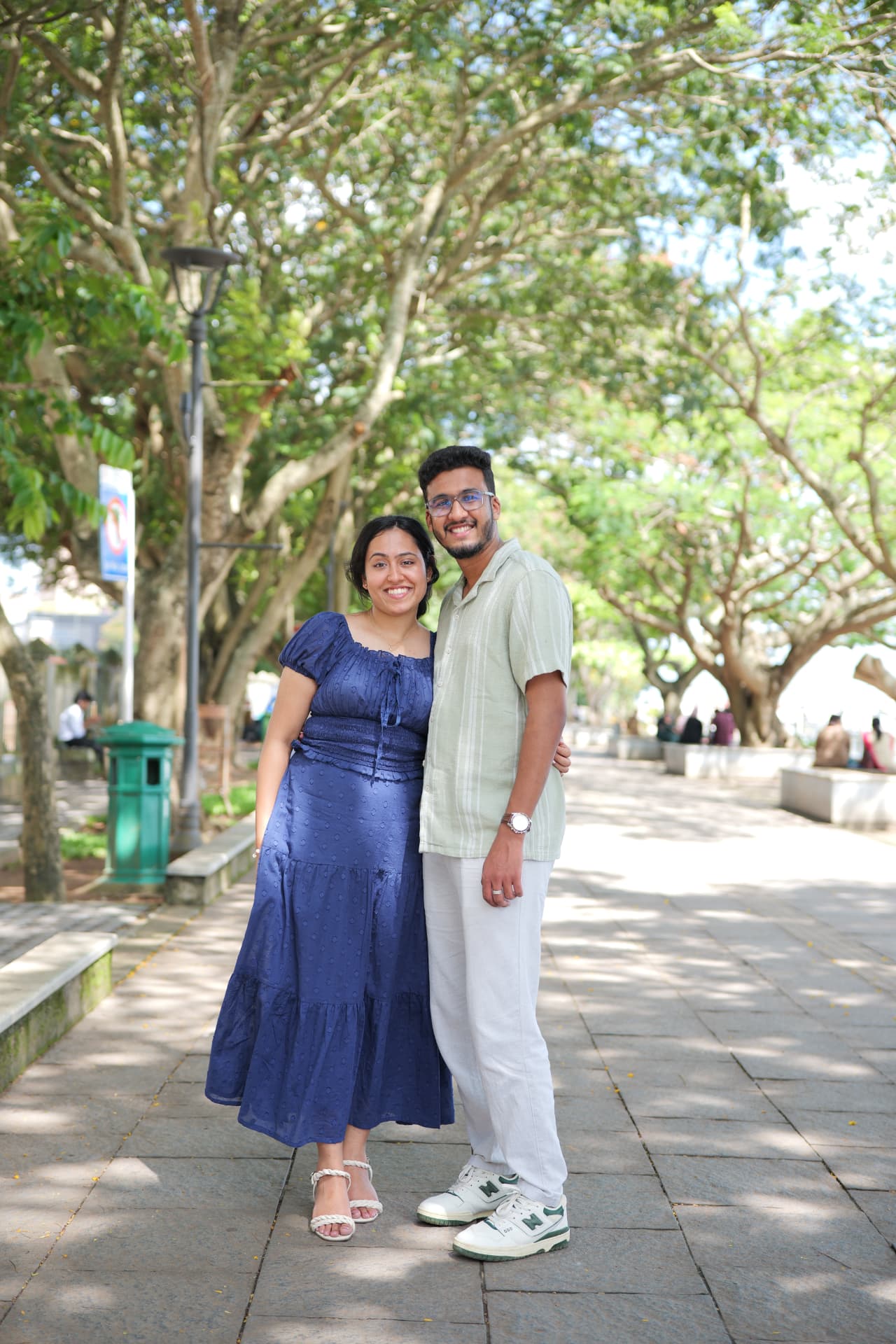 The couple on a tree-lined avenue
